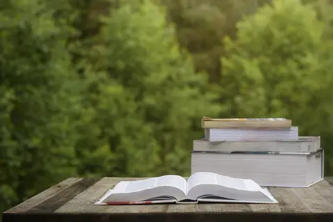 © Jessicahyde | Dreamstime.com - Books On A Wooden Table Photo