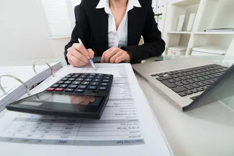 © Andreypopov | Dreamstime.com - <a href="https://www.dreamstime.com/stock-photo-businesswoman-calculating-invoice-close-up-calculator-image56849275#res2965056">Businesswoman Calculating Invoice Photo</a>