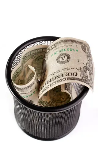 © Yurchyk | Dreamstime.com - Dollars In A Trash Bin Photo